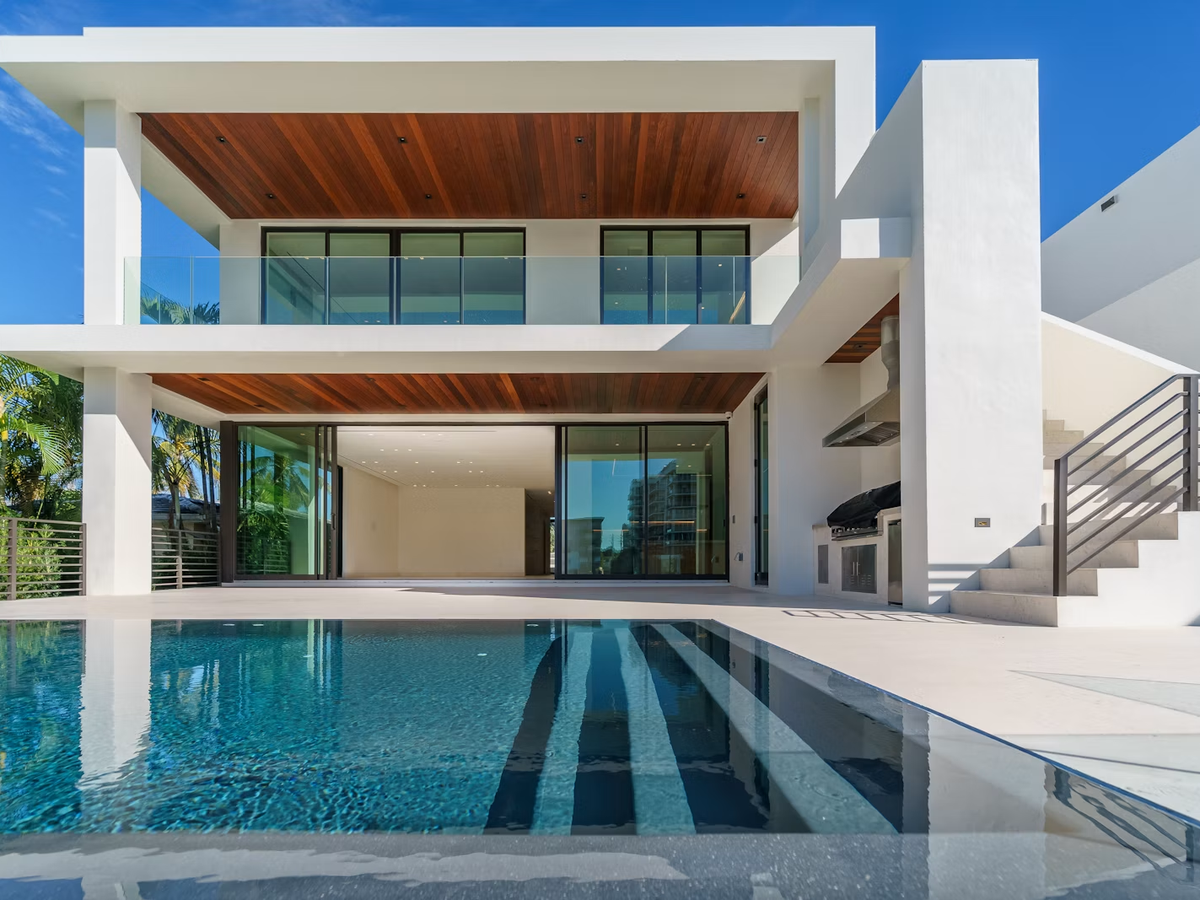 Two-storey home addition with timber soffits, glazing and a covered terrace